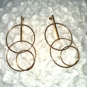 Gold hoops earrings.
